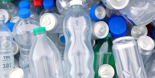 Plastic bottles and aluminium cans arranged for recycling.